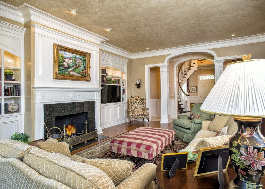 A living room filled with furniture and a fireplace.