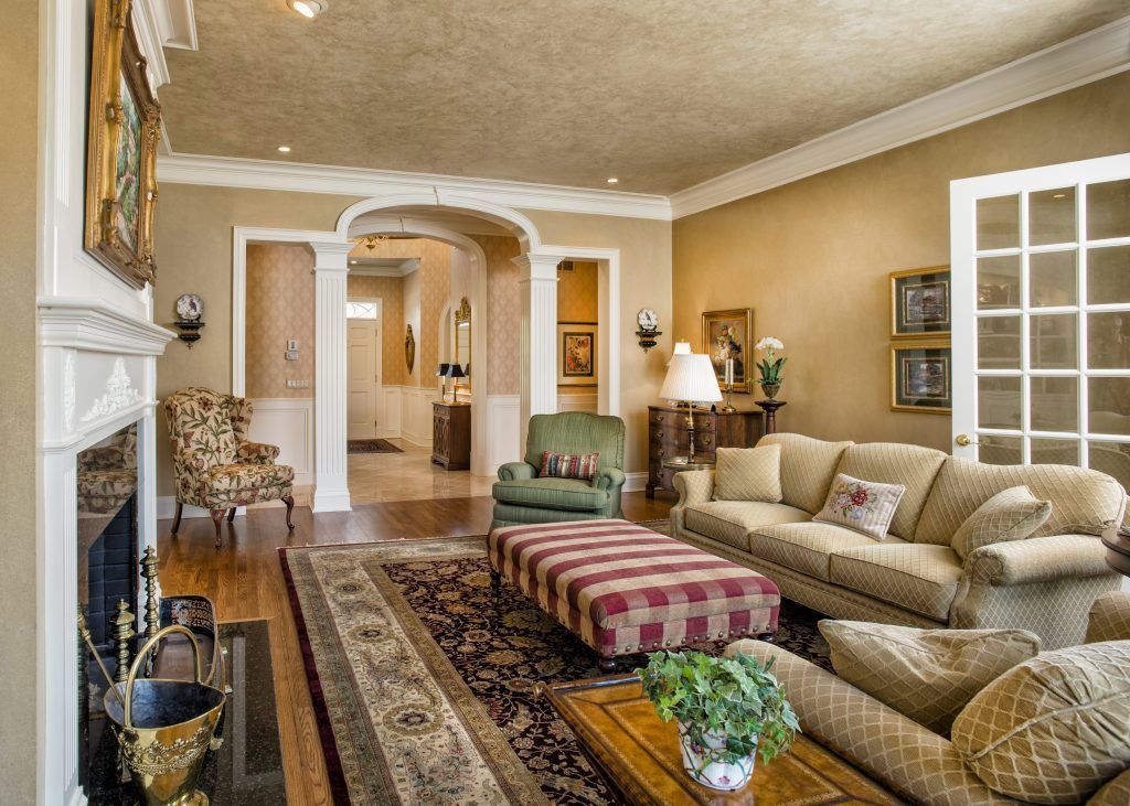 A living room filled with furniture and a fireplace.
