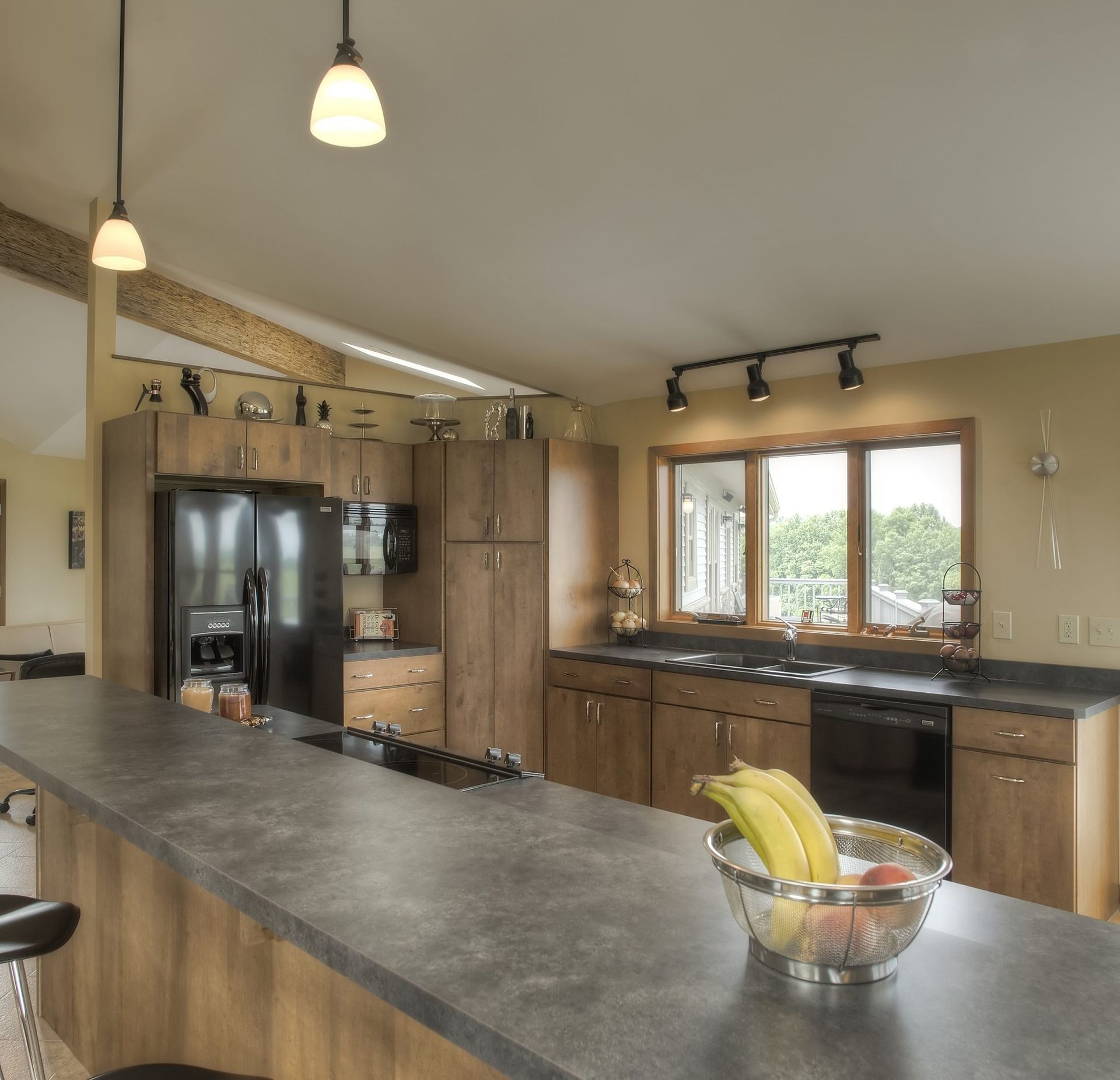 A kitchen with a bowl of bananas on the counter