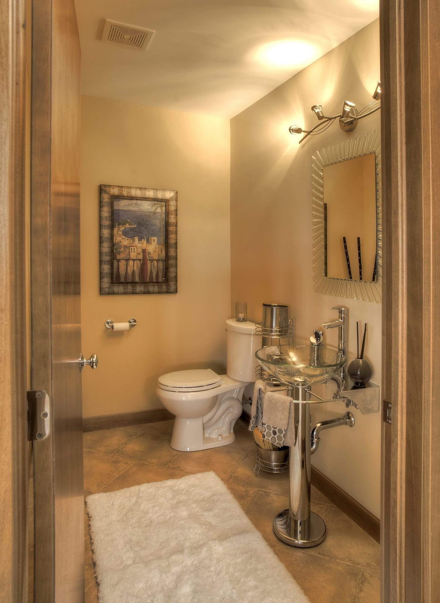 A bathroom with a toilet a sink and a mirror