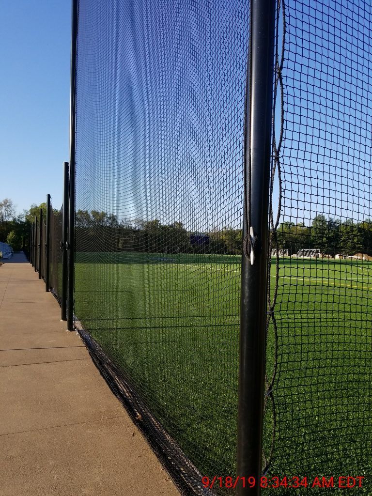 A baseball field is behind a fence with a time stamp of 8:11 am.