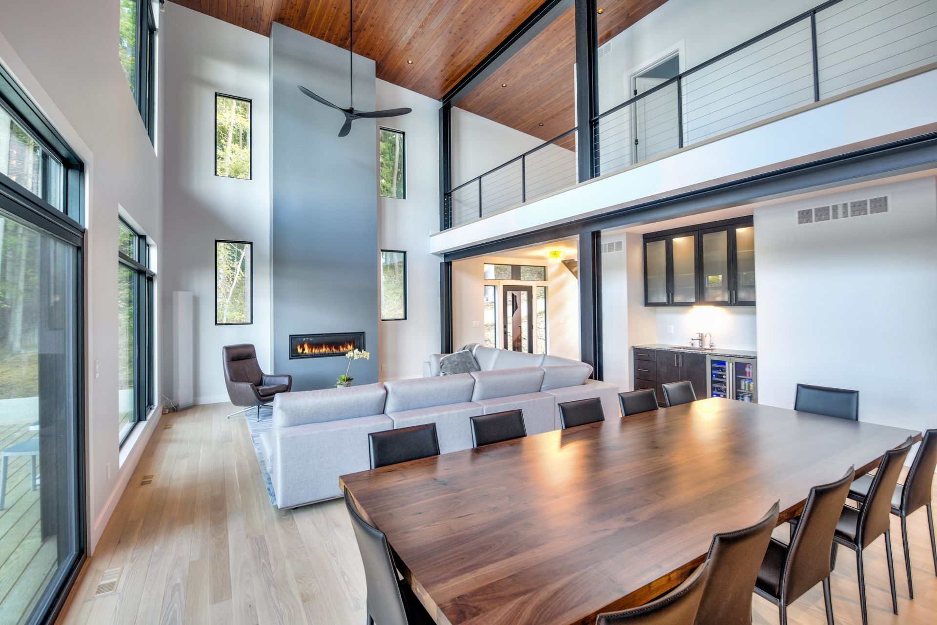 A large living room with a dining table and chairs.