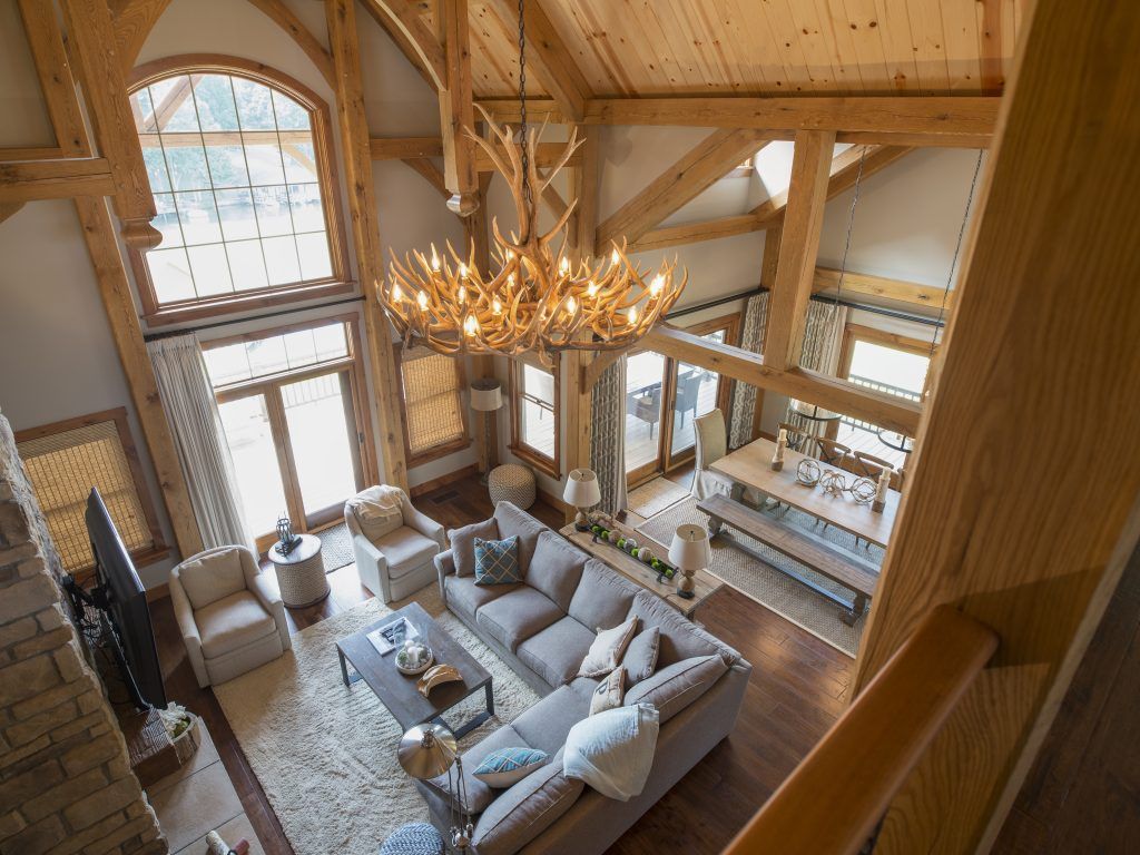 An aerial view of a living room with a chandelier hanging from the ceiling.