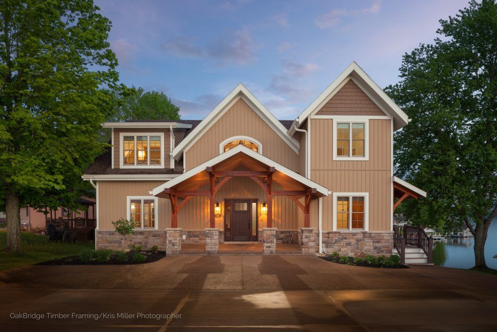 A large house with a lot of windows and a porch.