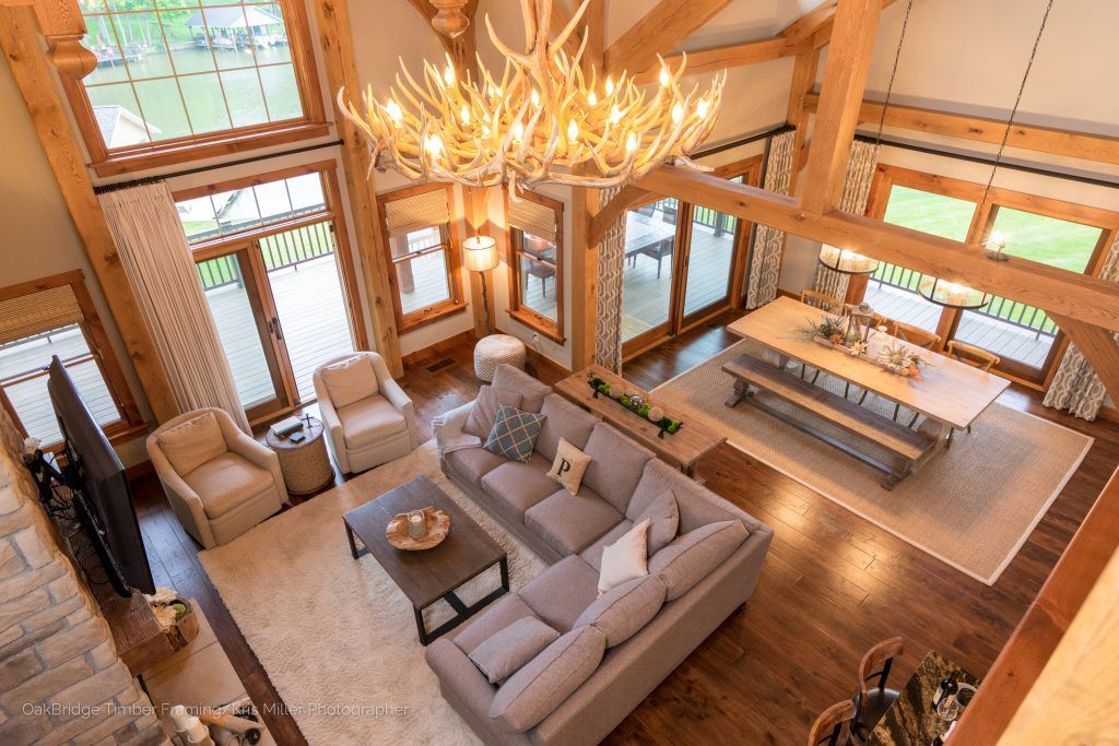 An aerial view of a living room filled with furniture and a chandelier.