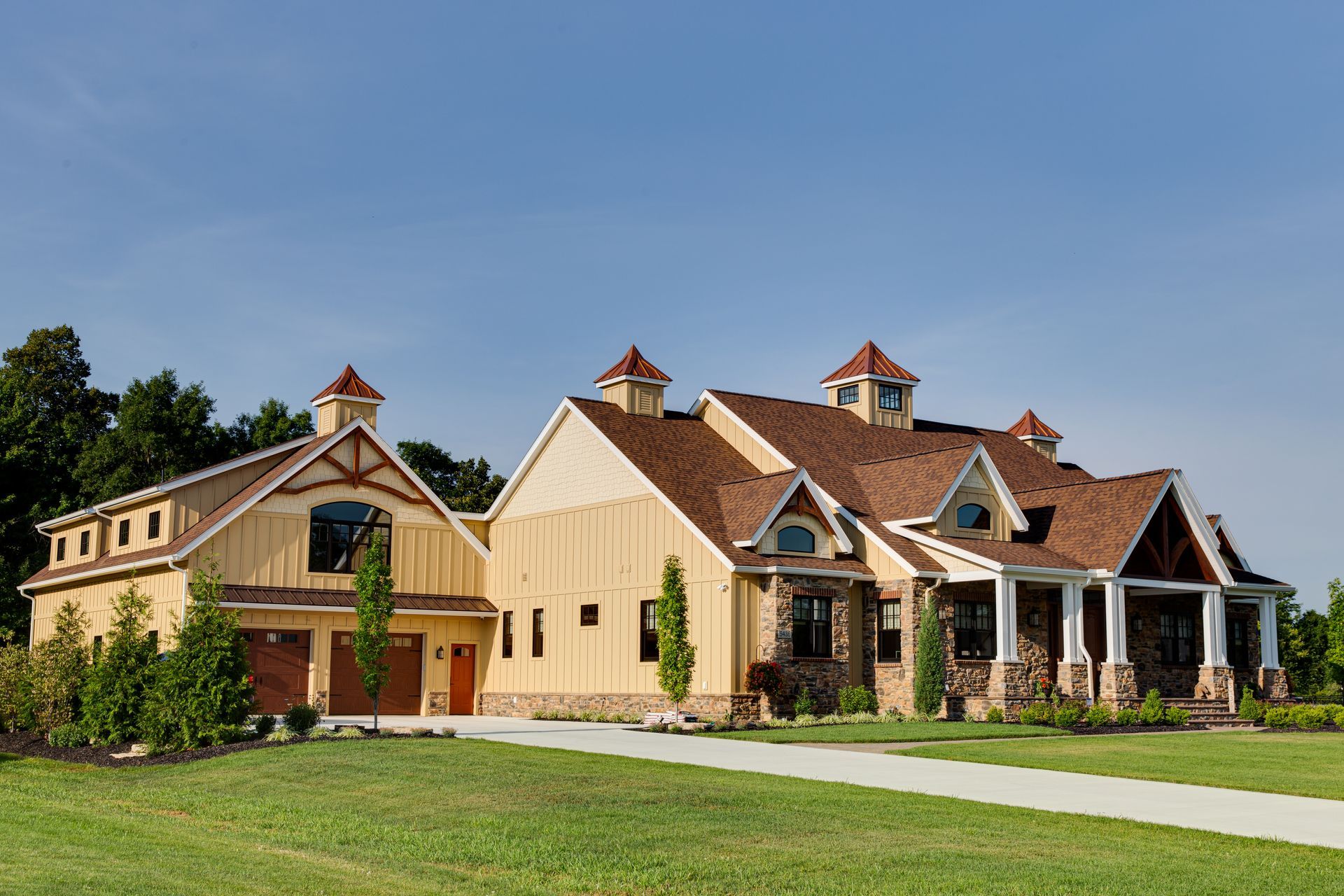 A large house with a barn attached to it.
