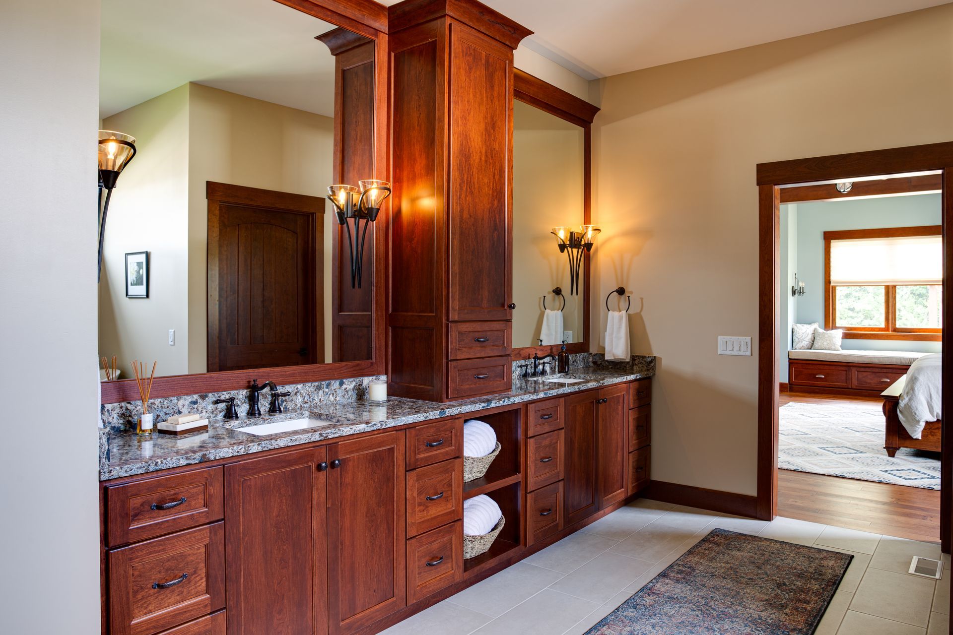 A bathroom with two sinks and a large mirror.