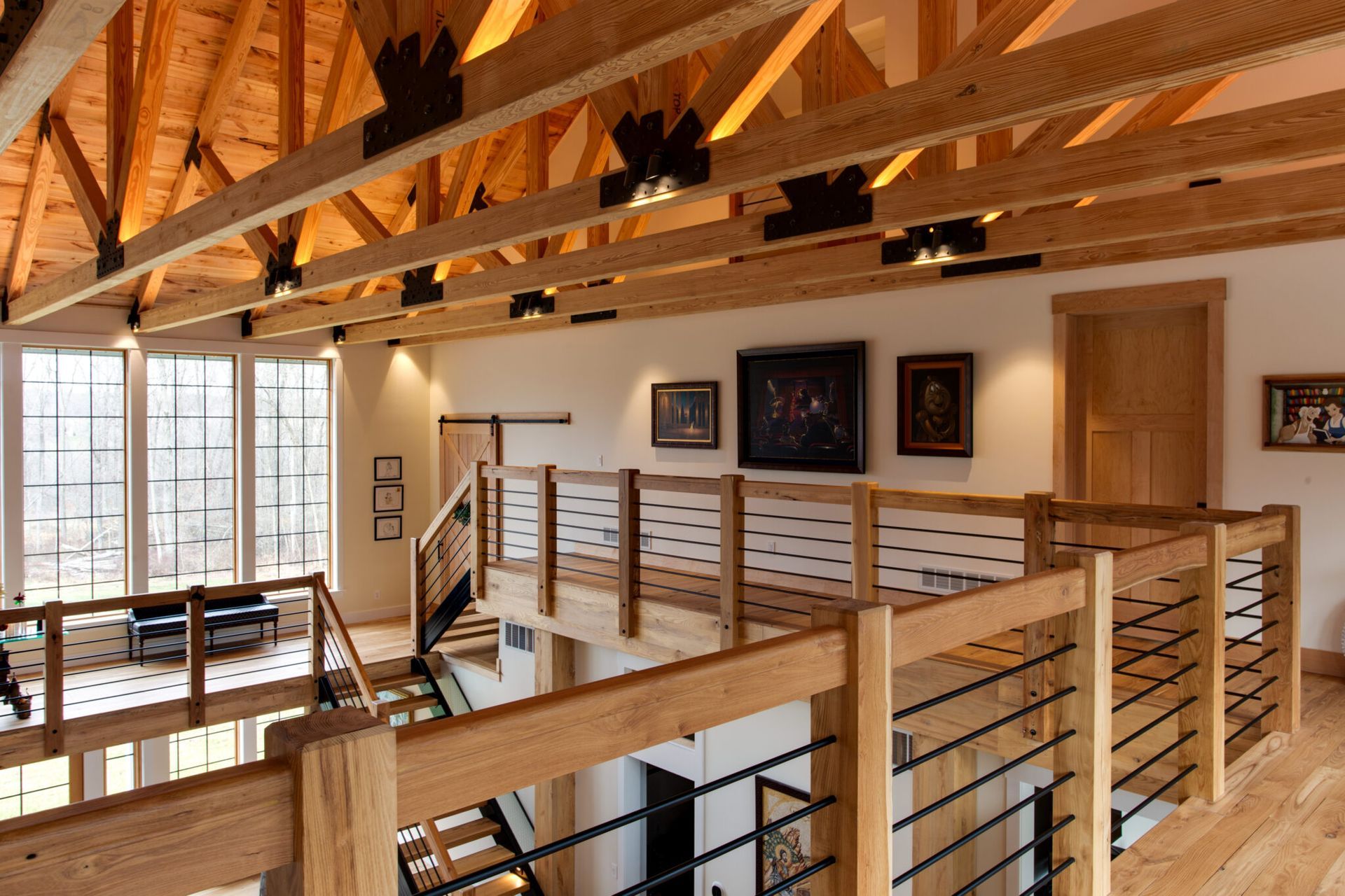 A room with a wooden railing and stairs.