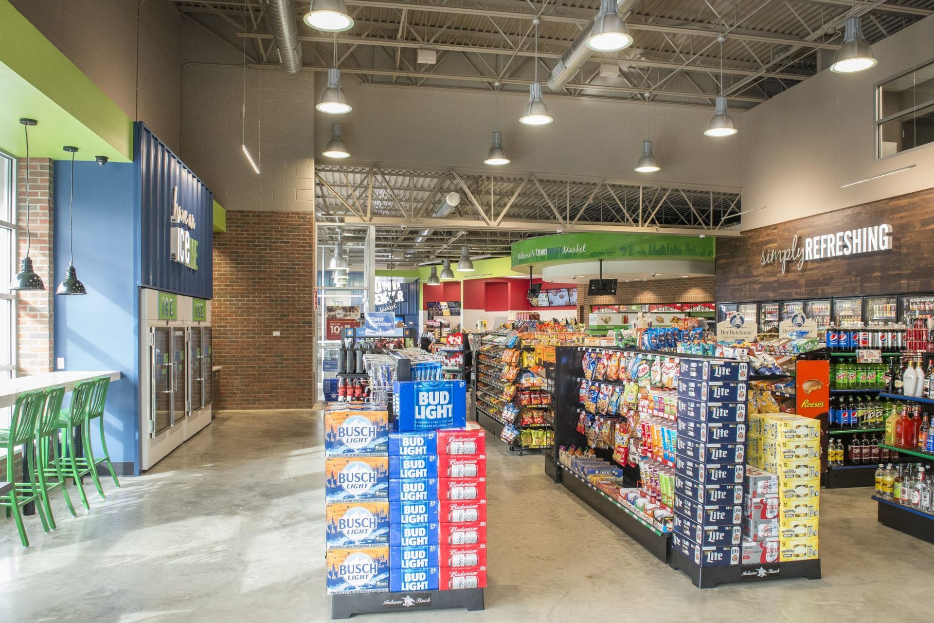 A grocery store with a lot of shelves and a brick wall.