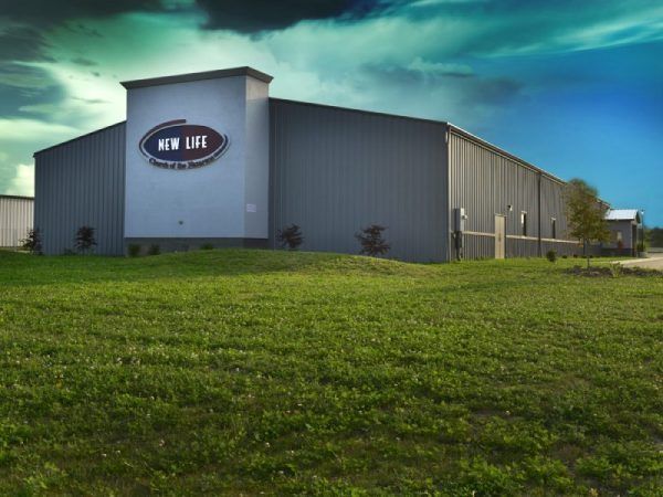 A large building with a New Life Church sign on the side.