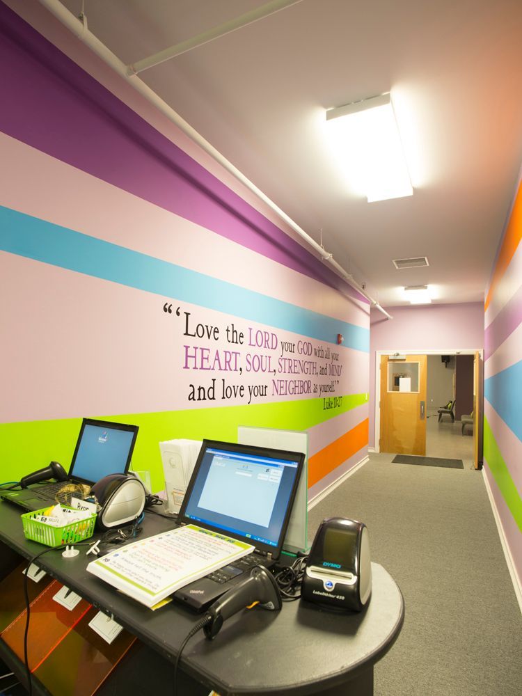 A colorful hallway with a quote on the wall.