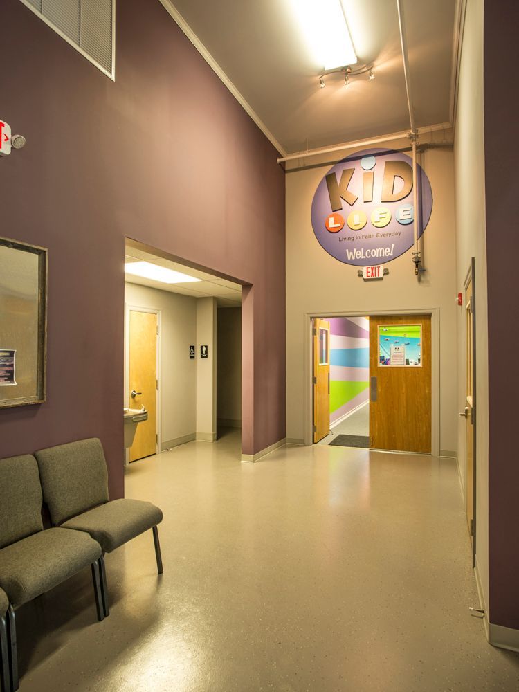 A hallway with a sign that says kid on it.