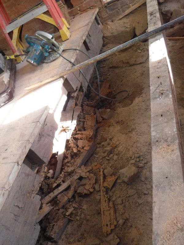 A machine is sitting on top of a pile of dirt.