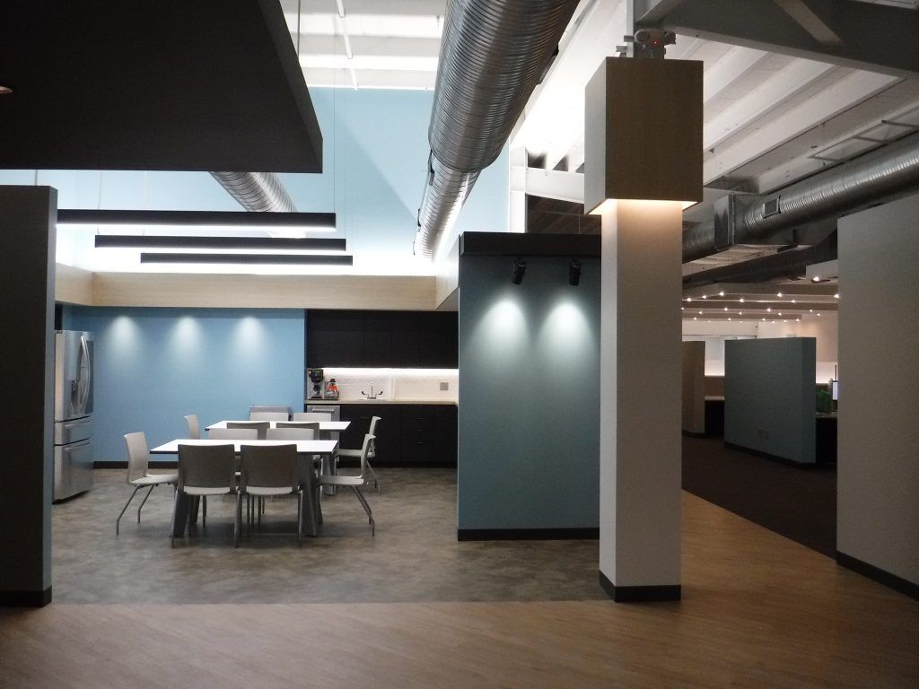 A large room with tables and chairs in it.