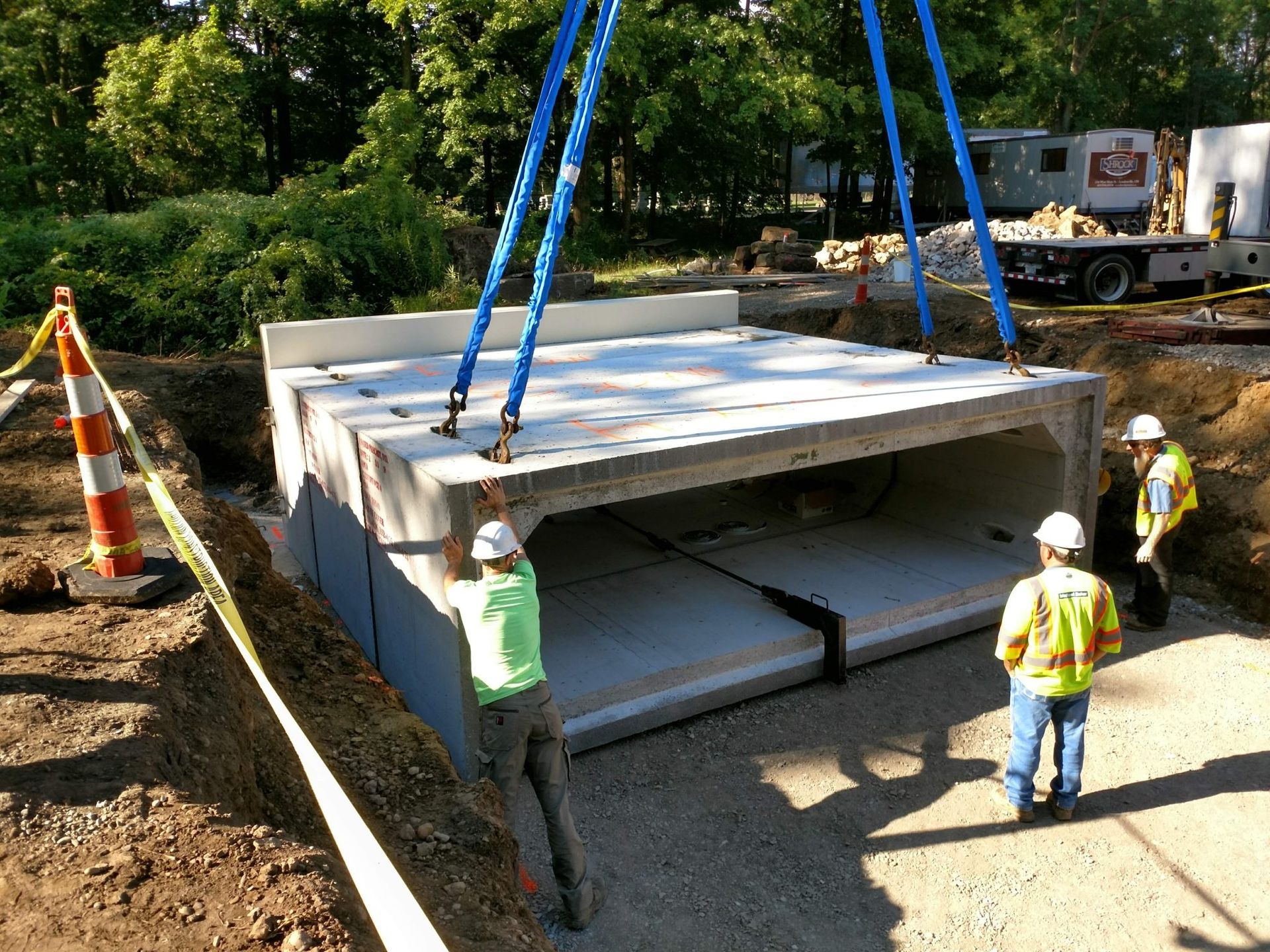 A group of construction workers are working on a bridge