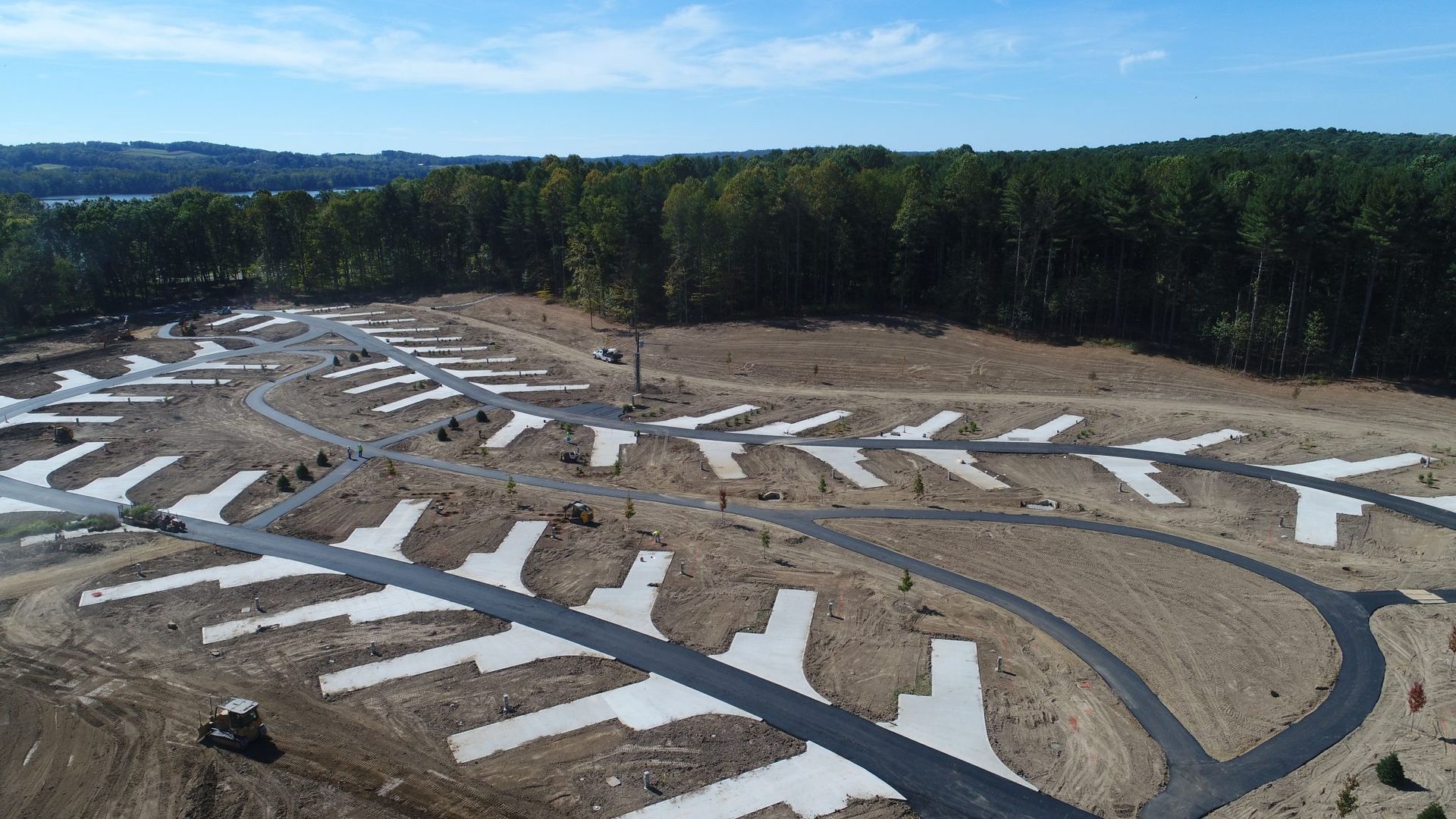 An aerial view of a campground surrounded by trees. 