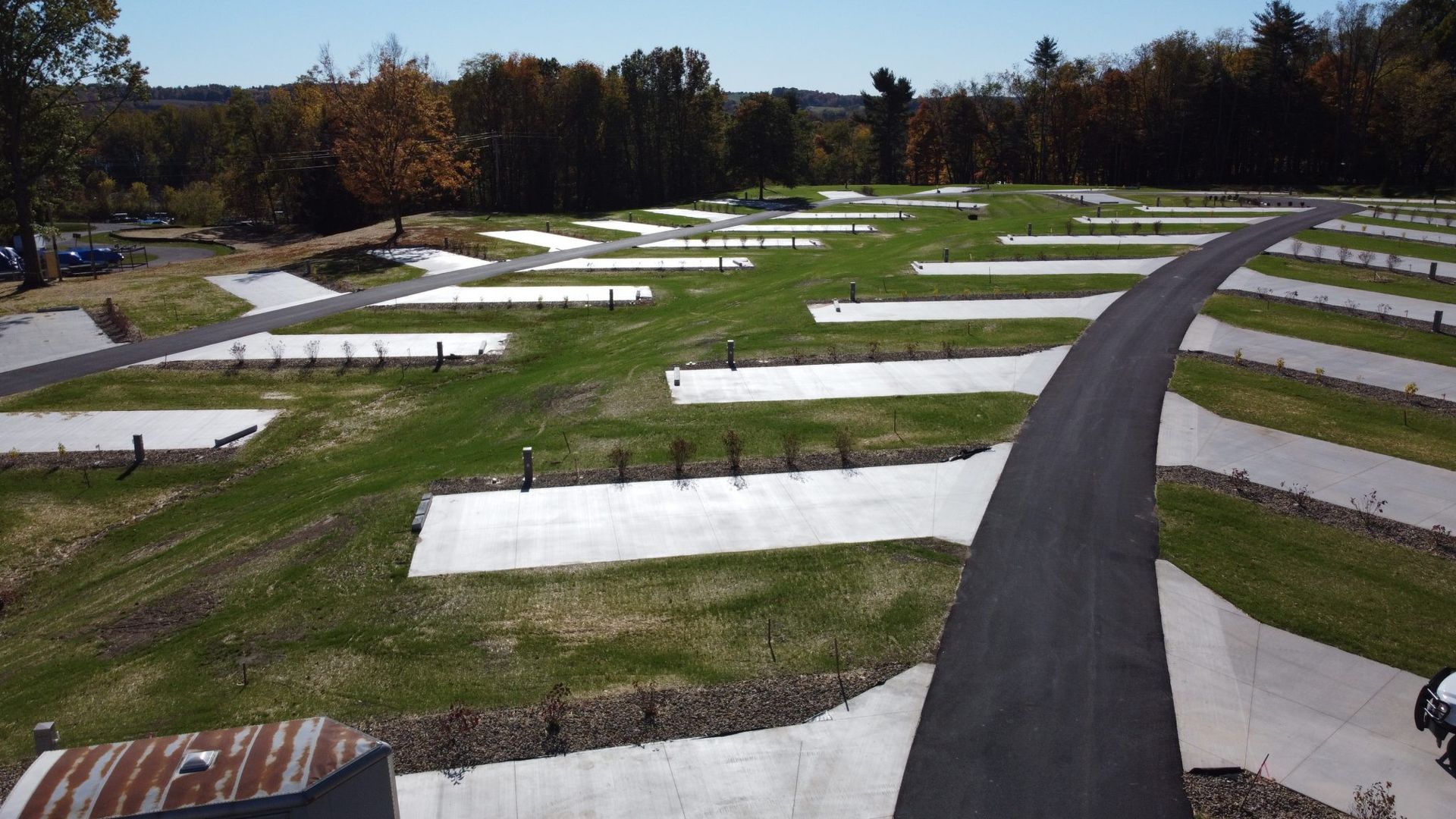 An aerial view of a campground with lots of grass and trees.