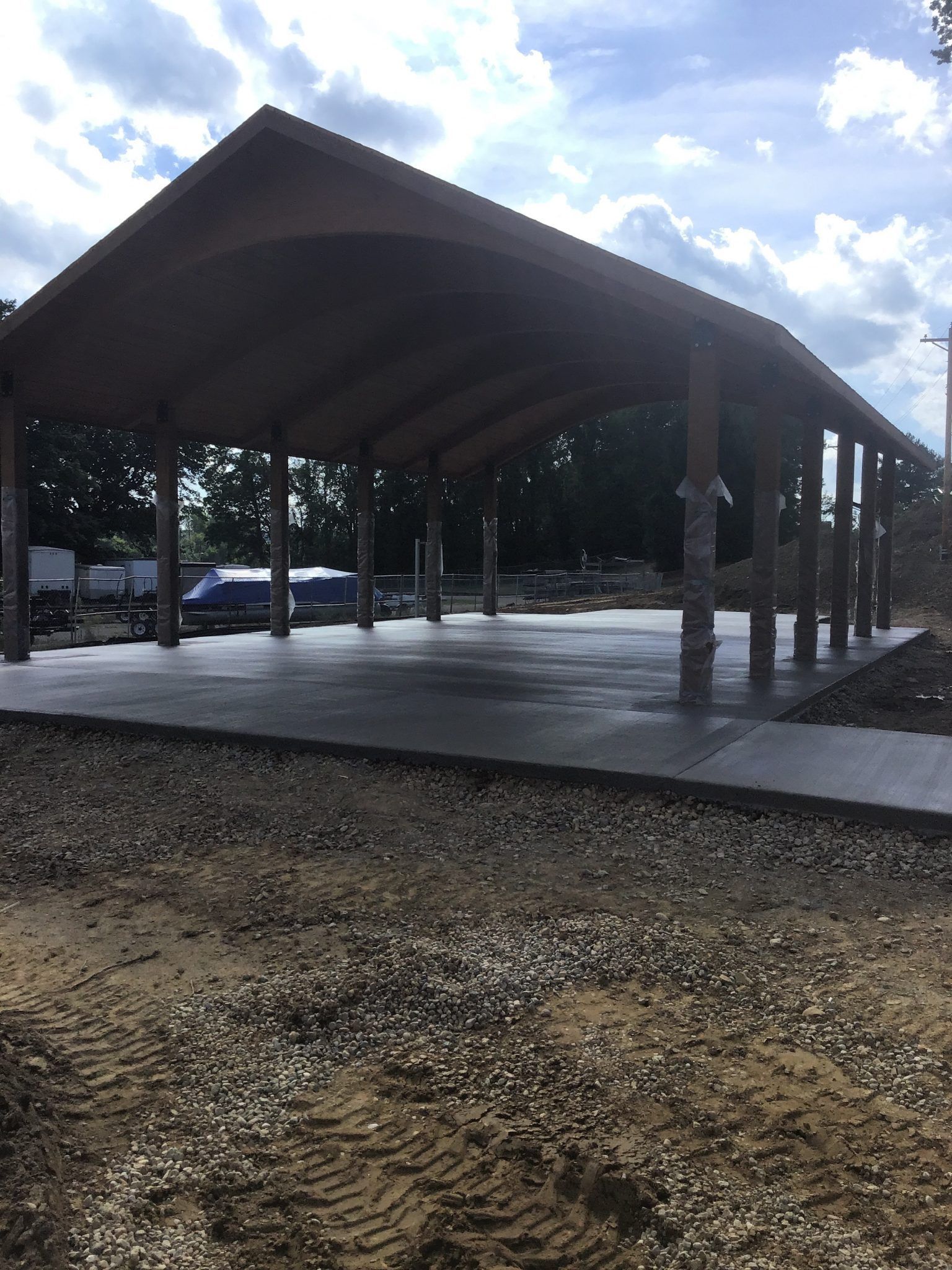 A large covered area with a wooden roof.
