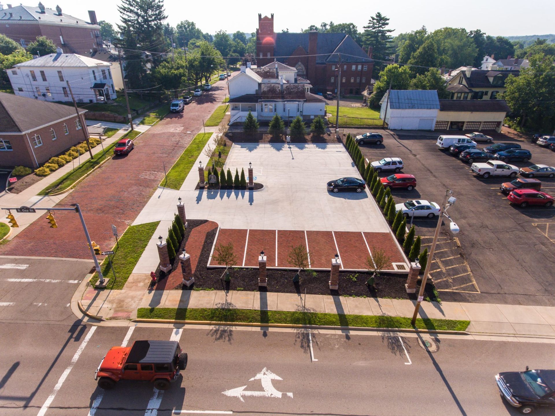 An aerial view of a parking lot in a small town.