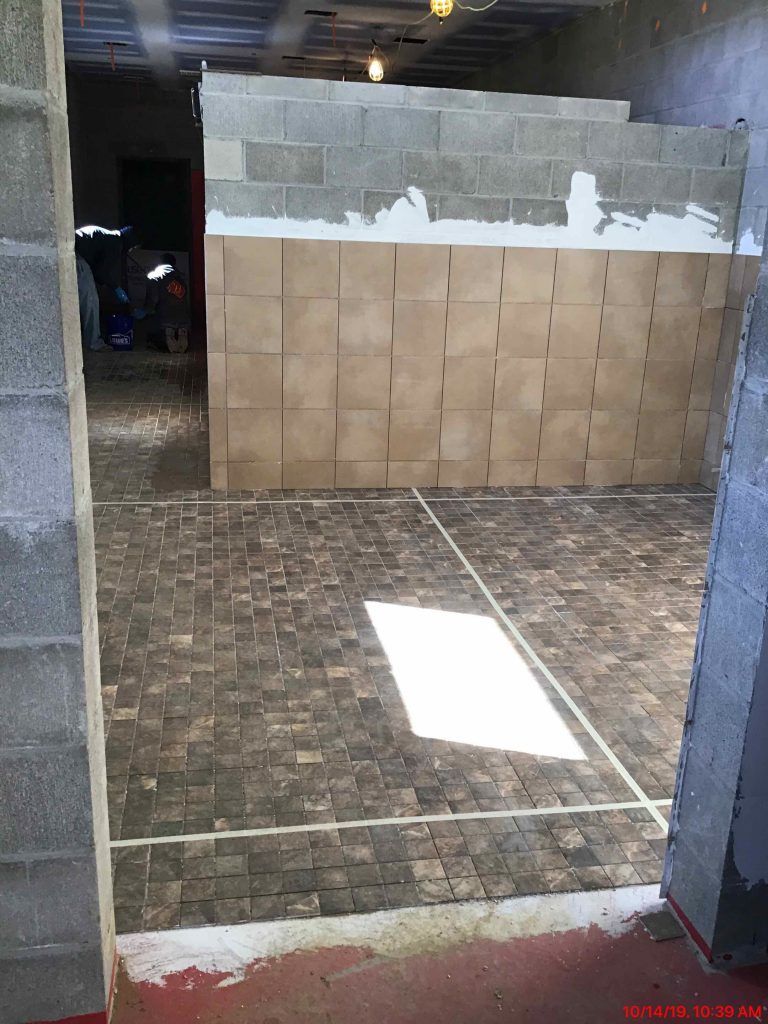 A room with a lot of bricks on the floor.