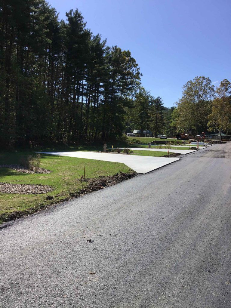 A road with a lot of trees on the side of it.