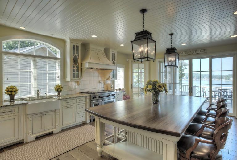 A large kitchen with a large island in the middle.