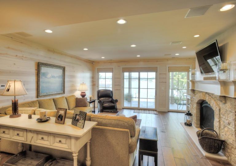 A living room filled with furniture and a fireplace.