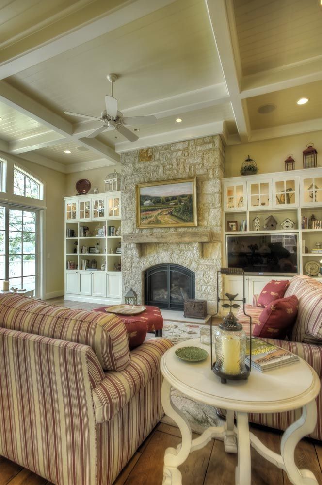 A living room with a fireplace and a couch.