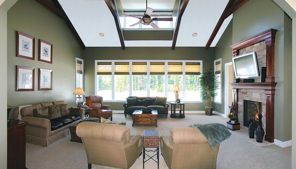 A living room filled with furniture and a fireplace.