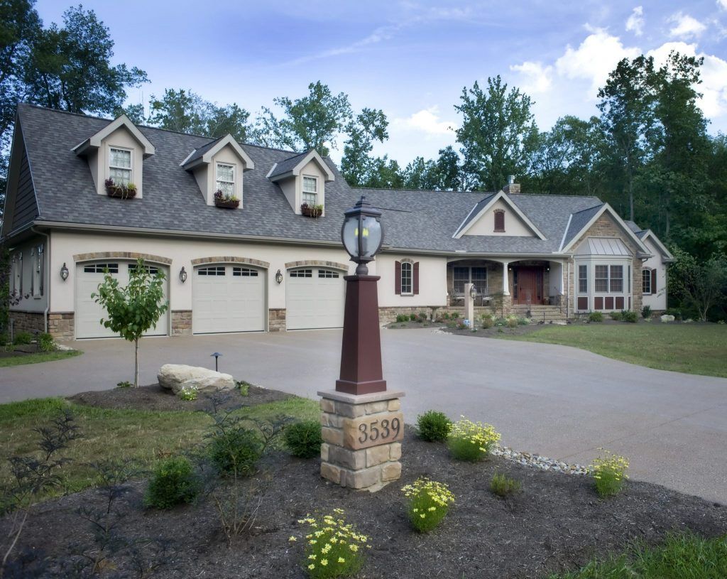 A large house with a street light in front of it.