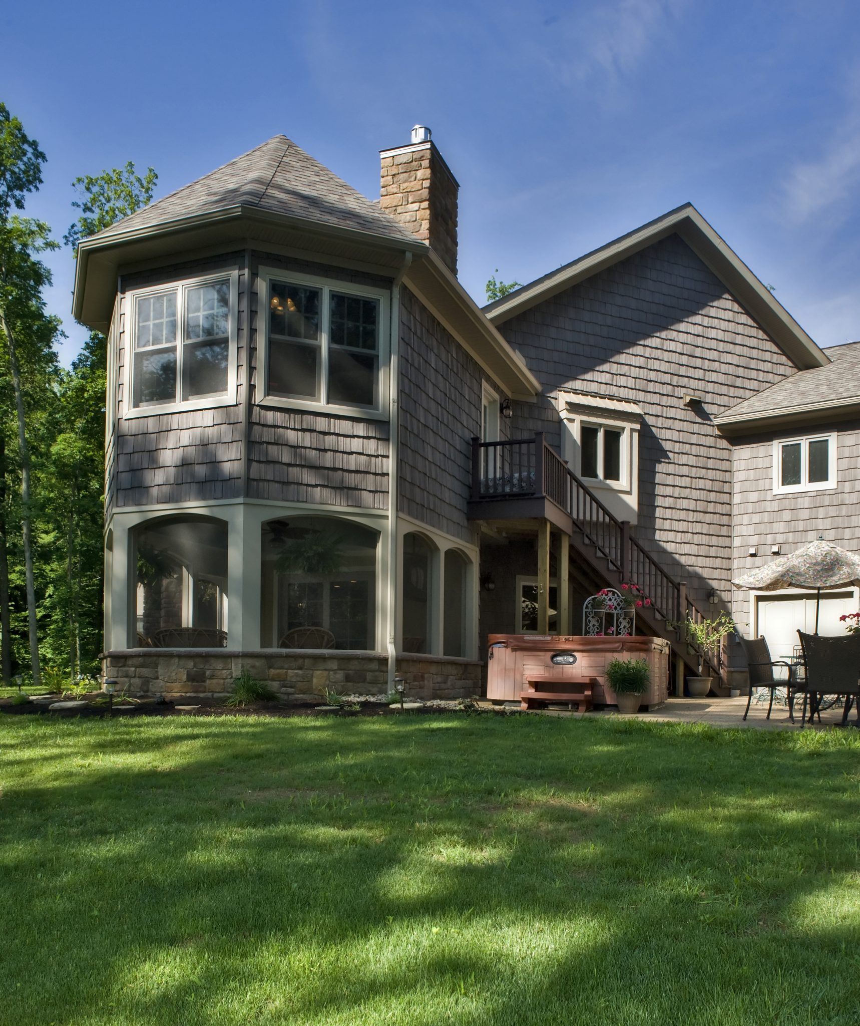 A large house with a large lawn in front of it.