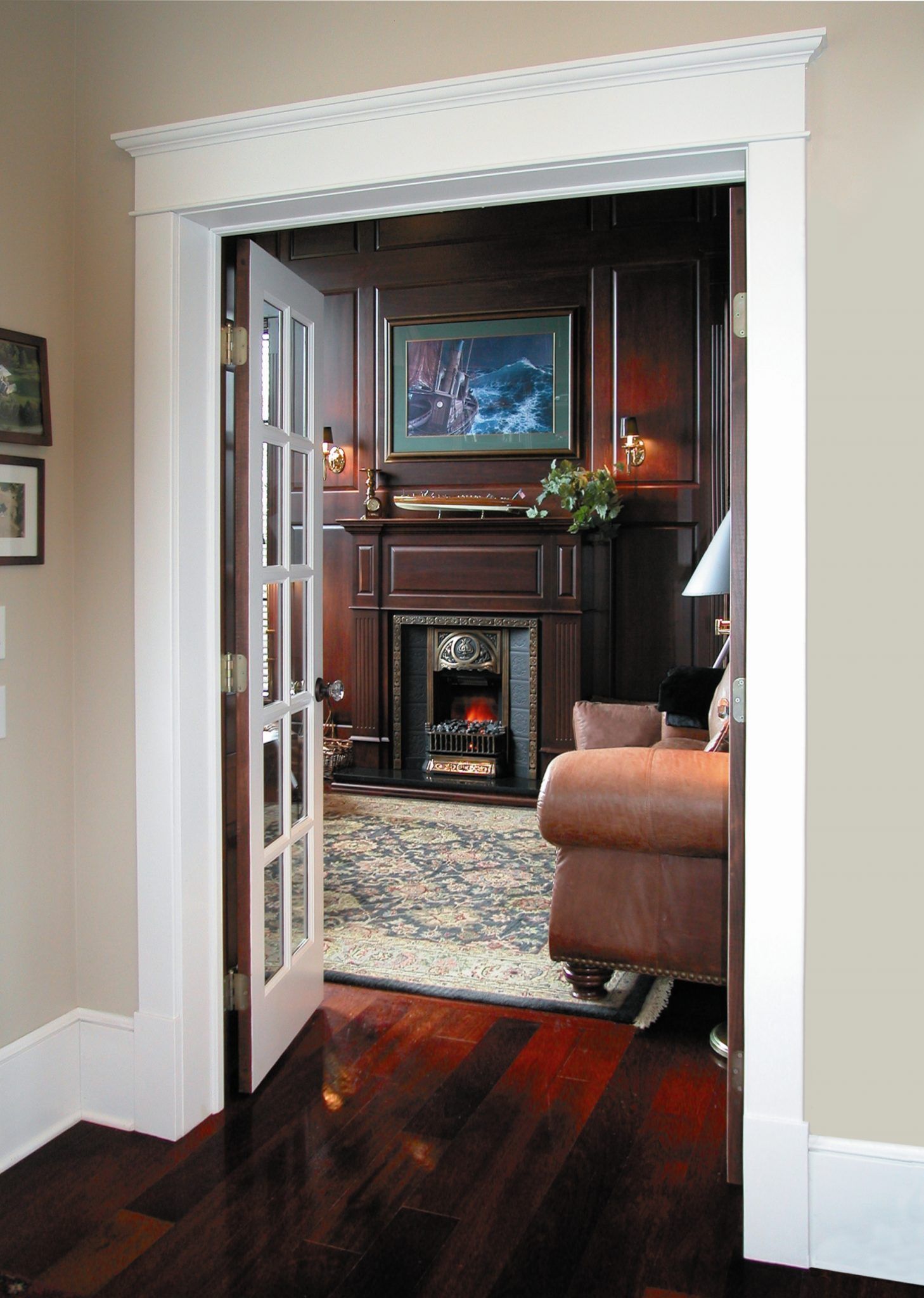 A living room with hardwood floors and a fireplace.