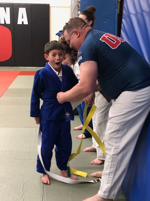 A man wearing a shirt with the number 8 on it