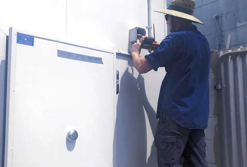 Technician Checking Switchboard — Refrigeration in Berrimah, NT