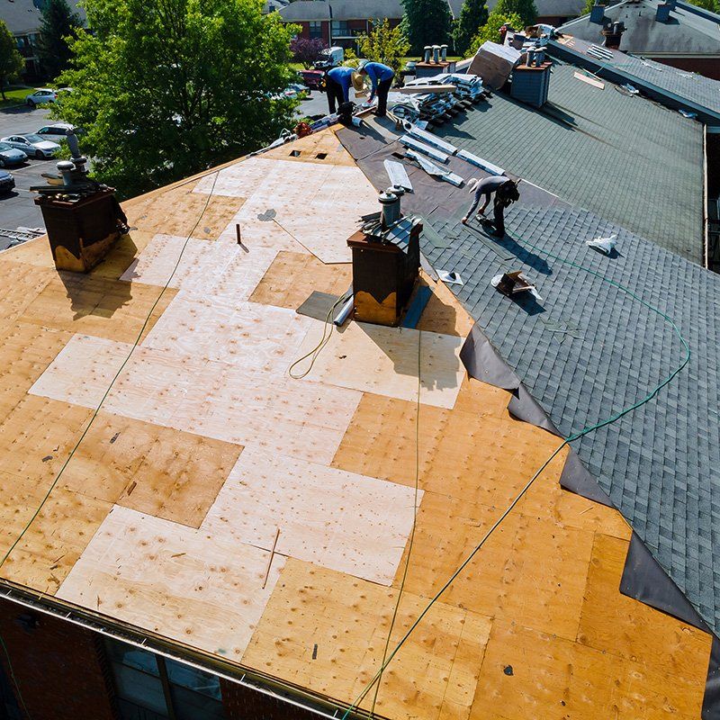 Workers Installing Asphalt Roof