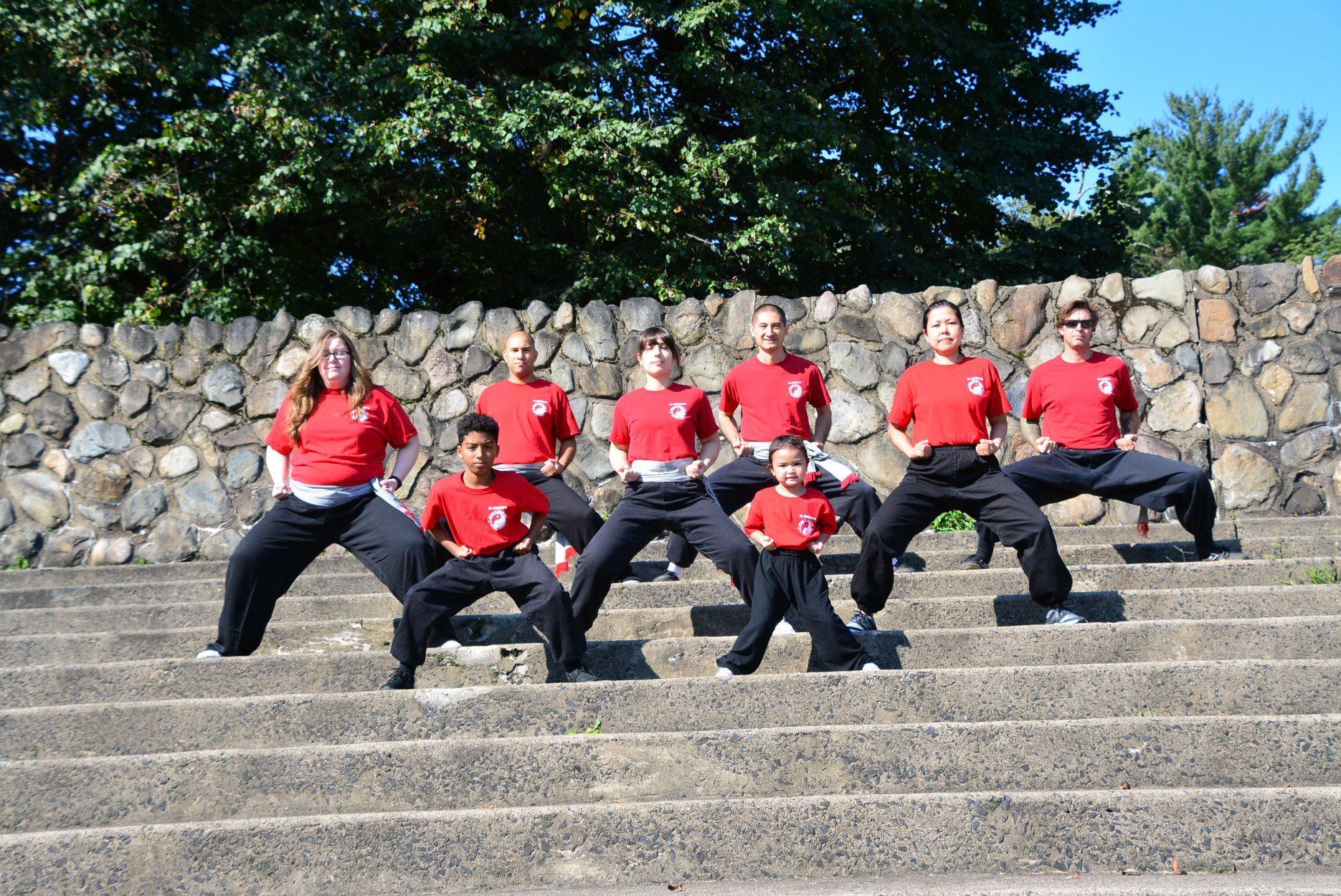 A group of people are posing for a picture on a set of stairs