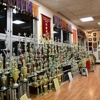 A room filled with lots of trophies and medals