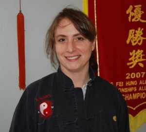 A woman stands in front of a banner that says 2007