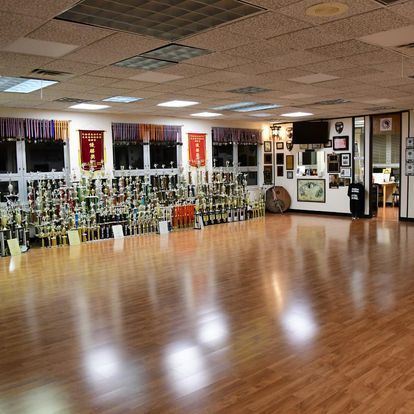 A large room with a lot of trophies on the floor