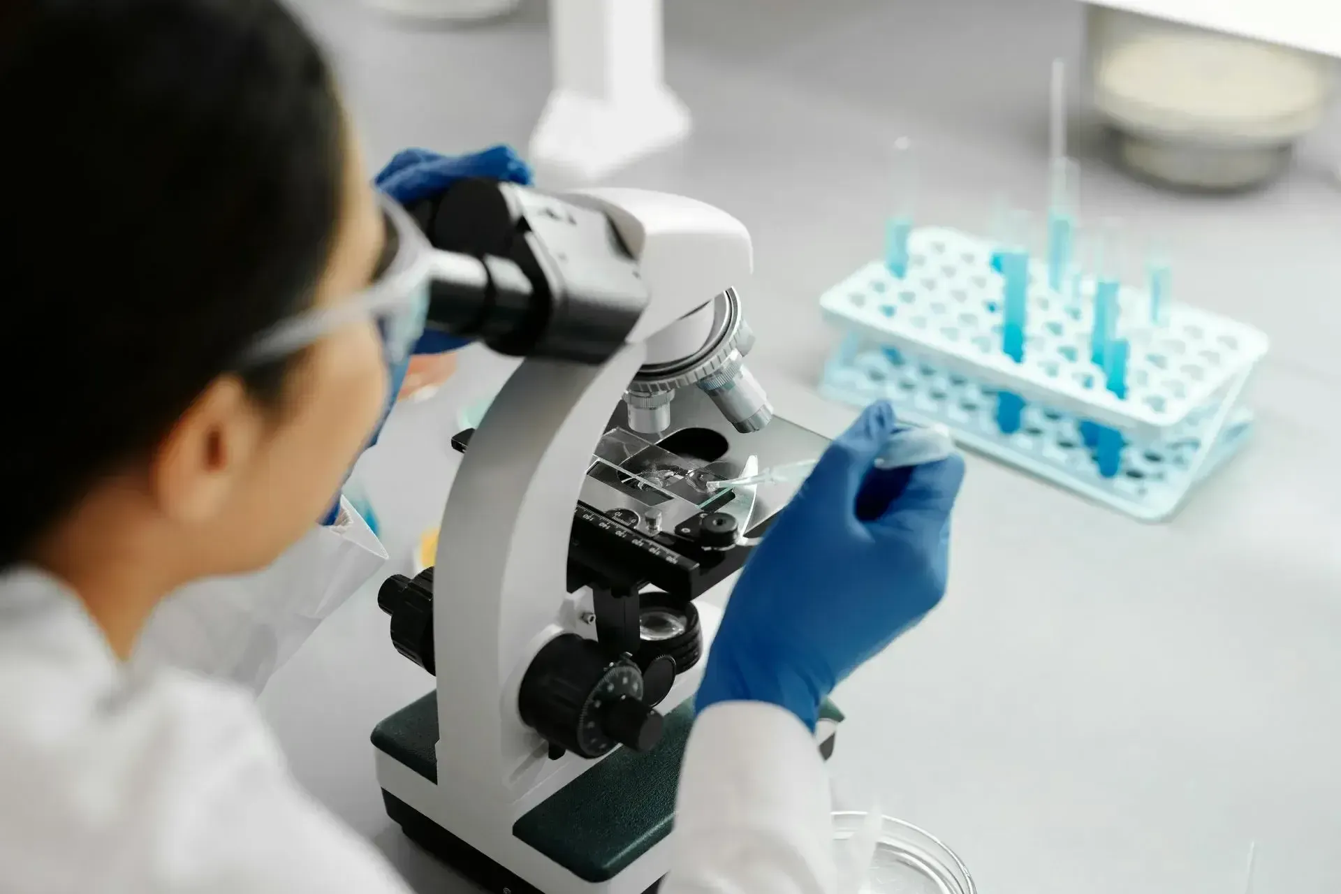 Woman looking through microscope