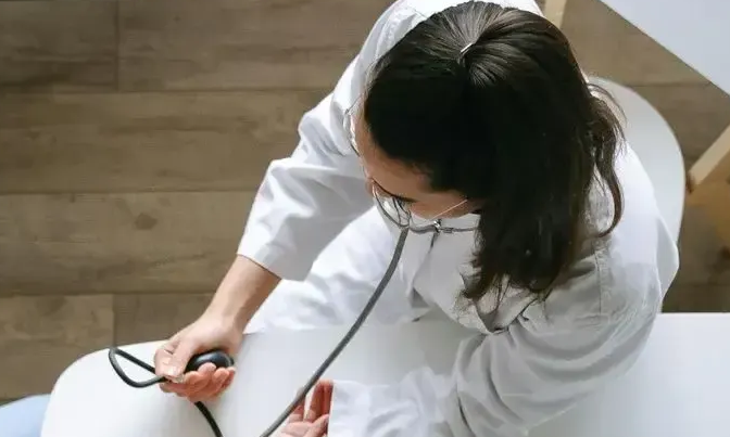 Aerial view of doctor holding patients hands