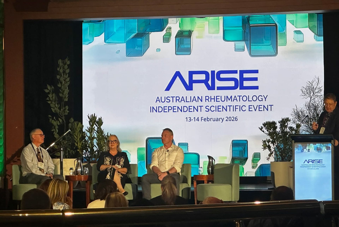 Scientist looking through microscope