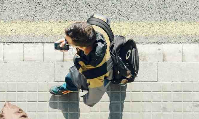 Aerial view of 2 men walking down footpath