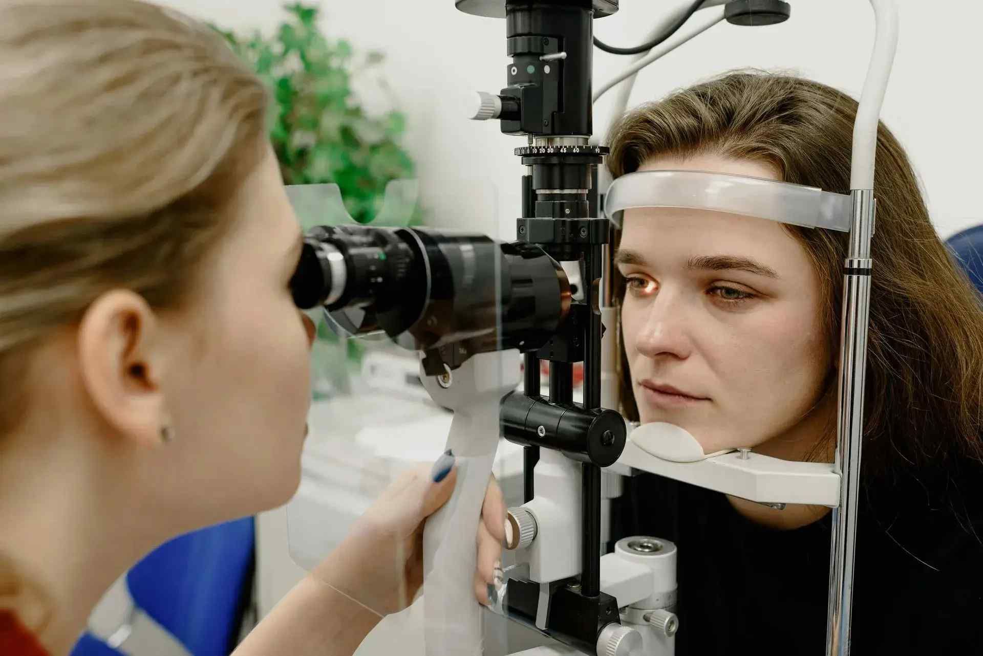 young woman getting eye test