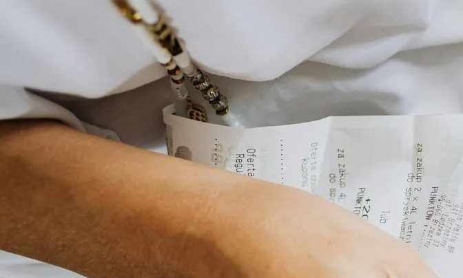 hands holding a receipt