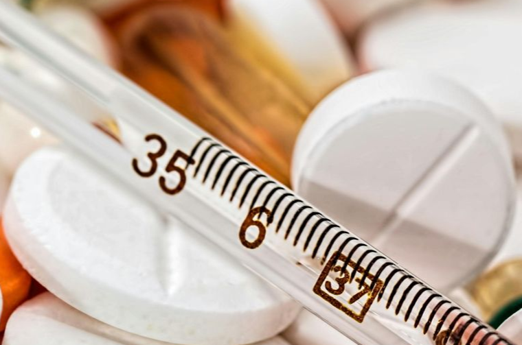 people sitting around boardroom table, 2 men, 2 female