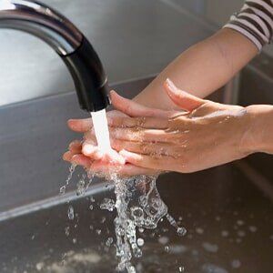 Boy Washing Hands by Water - Home Plumbing Inspection in Cheyenne, WY