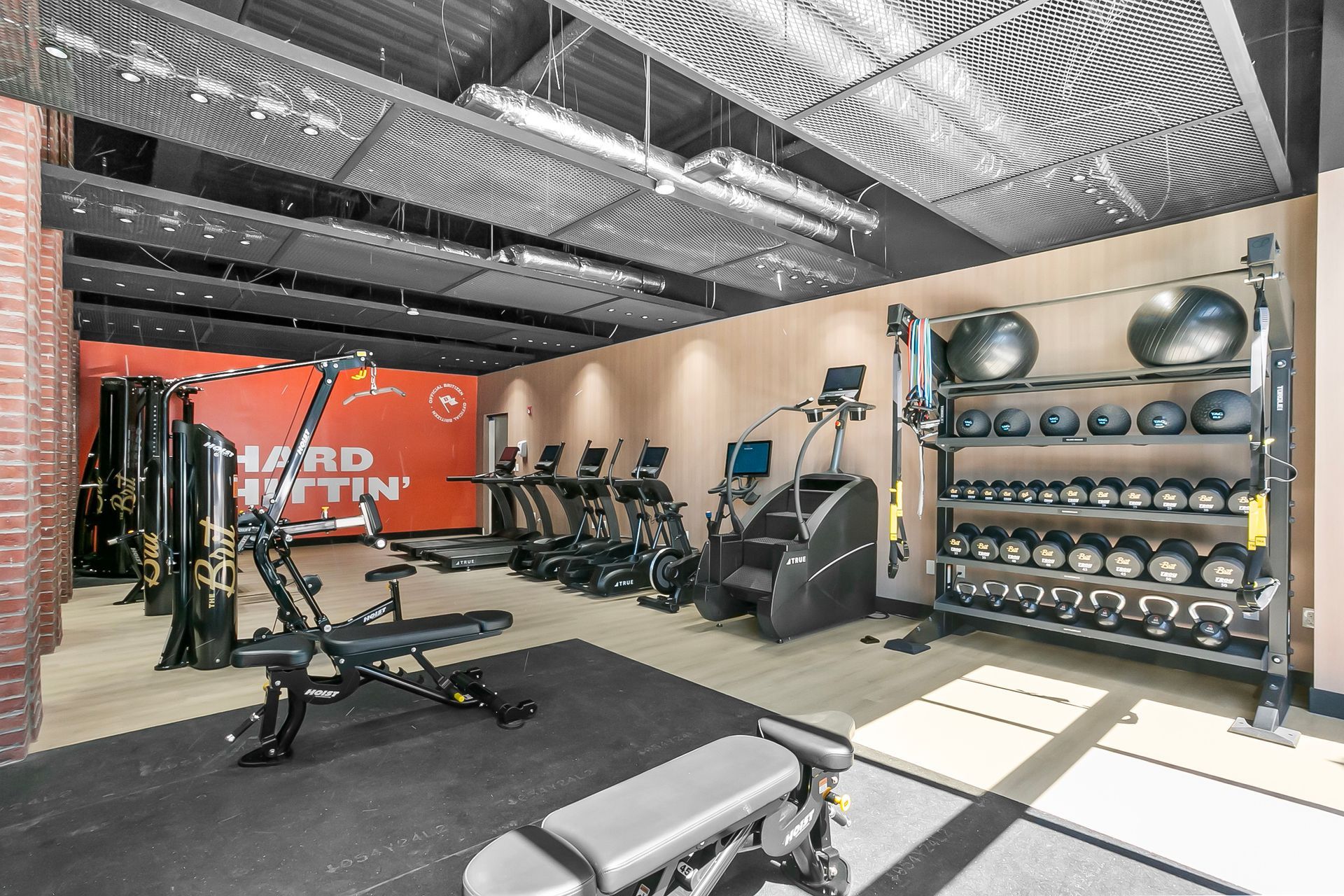 Gym interior with weights, cardio machines, and a