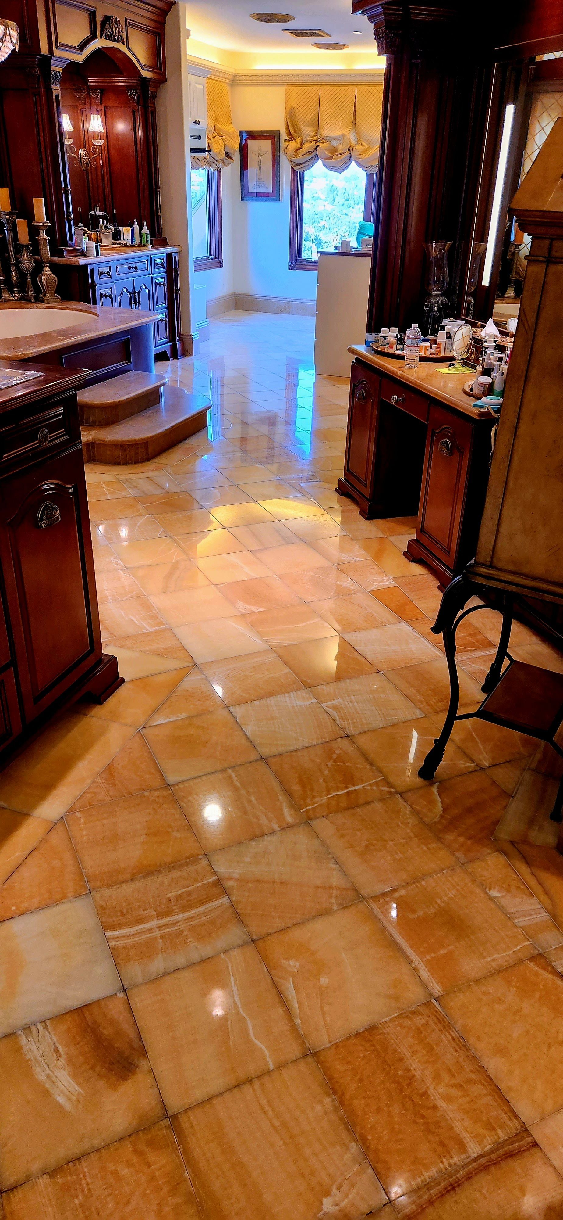An aerial view of a living room with a couch , table , and plant.