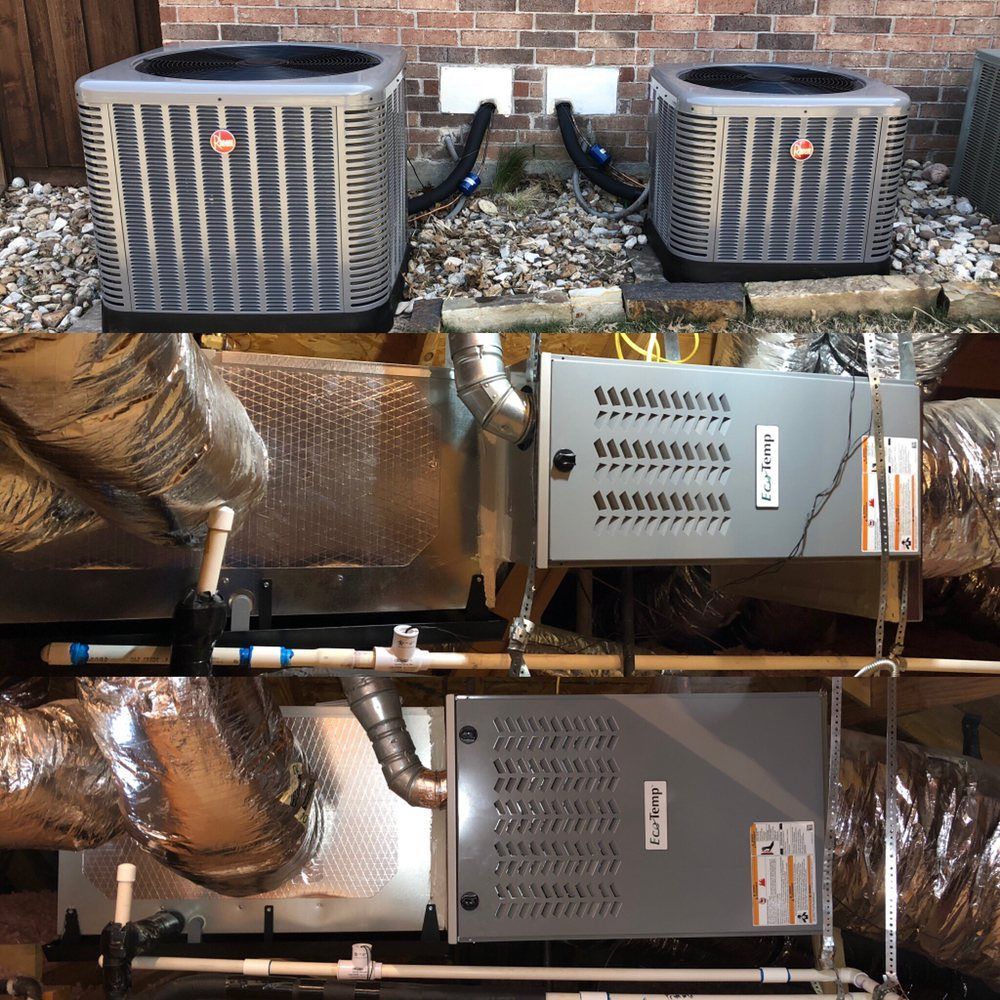 Two air conditioners are sitting on top of each other in a room